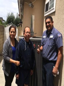 Frank with a happy customer after hvac installation in the