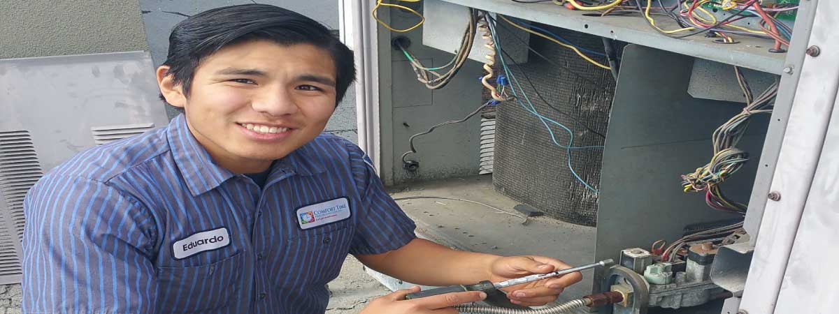 Eduardo working on a commercial heating system