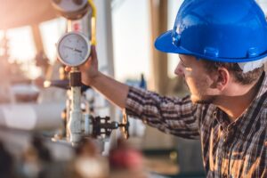 Guy Monitoring Gas Furnace